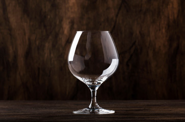 Empty brandy or cognac glass, copy space, selective focus