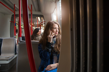 Young woman rides public transportation to work