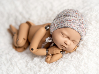Mannequin of newborn for photo posing