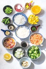 Ingredients for poke. Marinated fish (tuna and salmon),  seaweed,  mango, soybean Edamame,...