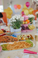 Fast food. Pizza birthday party in cafe with balloons