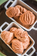 Chocolate ice cream balls close up and copy space