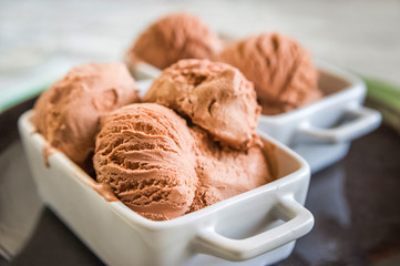 Chocolate ice cream balls close up and copy space