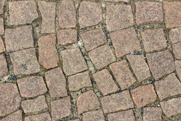 Texture of brown granite paving slabs