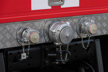Covered metal hydrants on the fire truck close-up