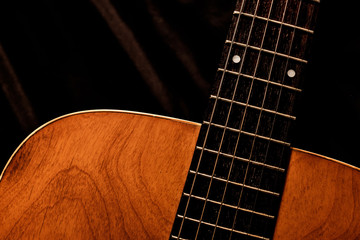 Obraz premium acoustic guitar on a black background