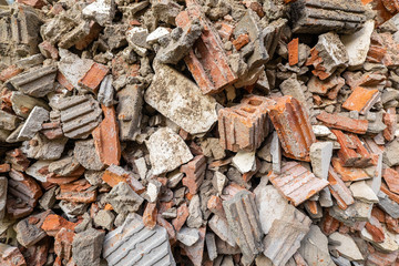 Pile of Red Brick and Cement After Destroyed Building. Piece of Brick  Wall are Crumbling from...