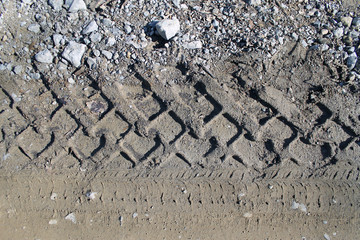 car tire tracks on wet muddy trail royalty, road, abstract background, texture material. Tyre track...