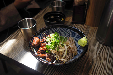 Chilled Wheat Noodle Soup with meat in a bowl , korean cold noodles 