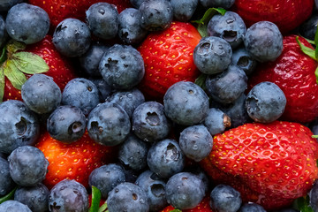 Fresh blueberries and strawberries closeup
