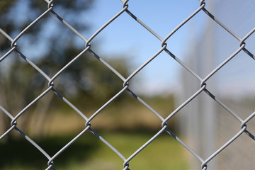 Fototapeta premium Detail of a fence with abstract background.