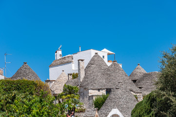 Alberobello, Italy. The picturesque village of trulli. Stone houses built in the typical circular...