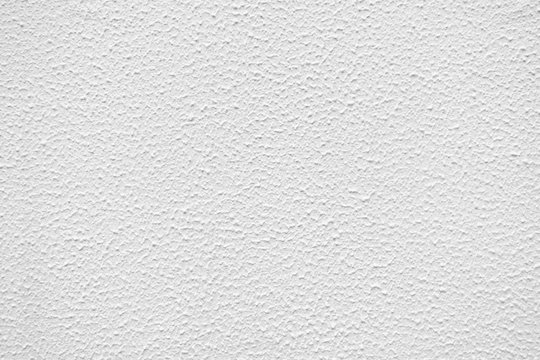 Nahaufnahme einer Wand mit feinem wei&szlig;en Strukturputz