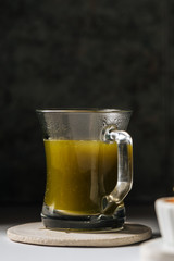 Hot matcha tea in transparent cups