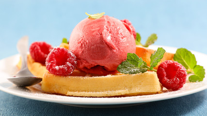 waffles with raspberry and ice cream scoop