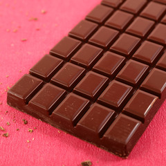 chocolate bar on red background