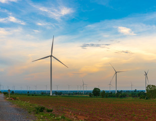 Wind turbines used to generate electricity Summer atmosphere Sunrise.