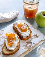 Toasted whole wheat bread with apple jam, ricotta (cream cheese)