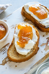 Toasted whole wheat bread with apple jam, ricotta (cream cheese)