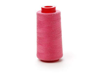spools of thread for the textile industry on white background