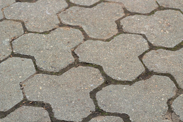 The texture of grey paving slabs on a cloudy day