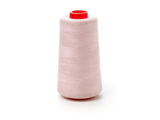 spools of thread for the textile industry on white background
