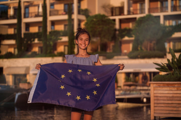 Child teenager girl holding an European Union flag 