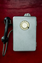old phone on red background