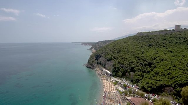 Aerial view of idyllic organized beach in Neo Panteleimona, Katerini, Greece, move forward  by drone