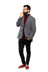 Fototapeta premium Handsome man with glasses with problems making suicide gesture over isolated white background