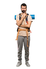 Hiker man thinking over isolated white background