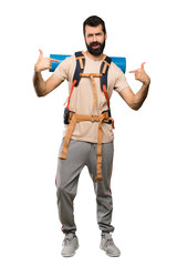 Hiker man proud and self-satisfied over isolated white background