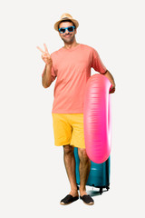 Full body of Man with hat and sunglasses on his summer vacation