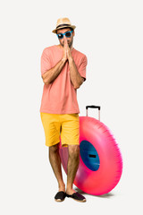 A full-length shot of Man with hat and sunglasses on his summer