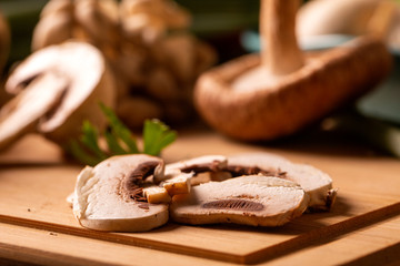 Various types of mushrooms on a wooden table