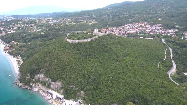 Aerial view of the castle of Platamonas on a hill in the area of Katerini Greece, backward movement by drone