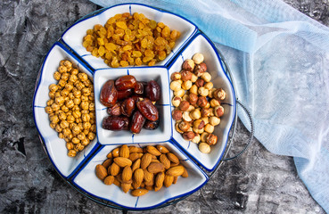 Various nuts and dried fruit arranged serving