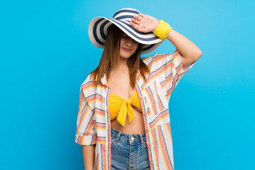 Young woman in bikini in summer holidays with tired and sick expression