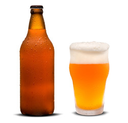 Glass of beer and Brown bottle with drops isolated on a white background