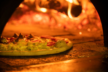 Italian pizza inside a wood oven