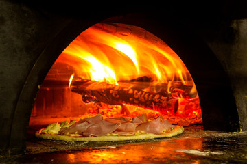 Italian pizza inside a wood oven