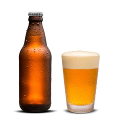 Glass of beer and Brown bottle 300ml  with drops isolated on a white background