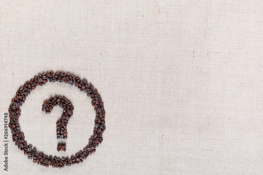 Fototapete question symbol in circle from coffee beans on linen texture, aligned bottom left.