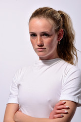 Obraz premium portrait of a young beautiful girl with blue eyes and freckles on a white background