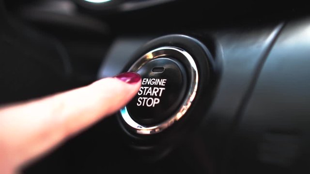 young girl presses the start stop button