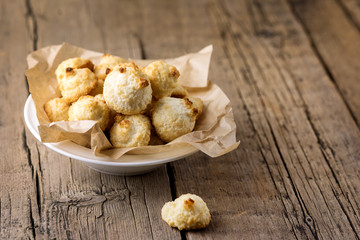 White Plate of Sweet Coconut Cookies on Old Wooden Background Horizontal Copy Space Tasty Coconut Dessert Homemade Coconut Cookies Rustic