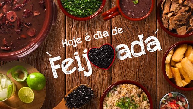 Stop motion Brazilian Feijoada Food. Written "Today is Feijoada's Day" in Portuguese. Top view with copy space. 