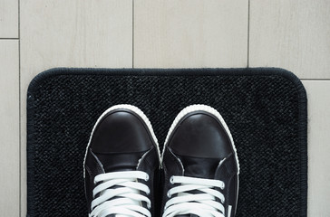 Boots on faux fur rug