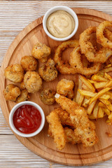 Half beer plate on wooden background top view.