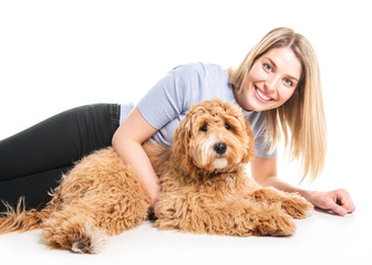 woman with his Golden Labradoodle dog isolated on white background